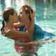 mand and wife kissing in pool with clothes on; MarriageHeat