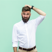 Bearded man scratches head with doubtful look on face ~ MarriageHeat