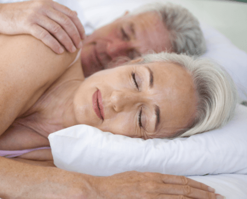Older couple spooning and sleeping ~ MarriageHeat