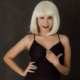 Woman in Blonde Wig with Blue Nail Polish