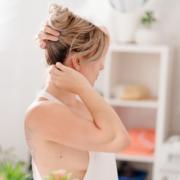Wife wearing her husband's thin sleevless T-shirt checks her appearance in the mirror ~ MarriageHeat