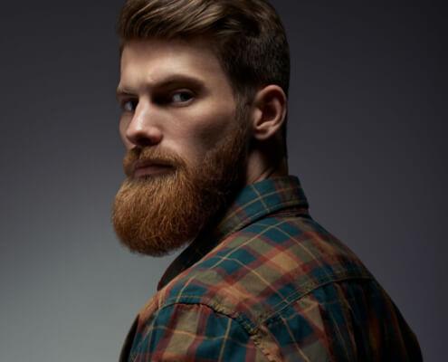 Mitzy's dream husband, a bearded man in a flanel shirt gives a piercing look over his shoulder ~ MarriageHeat