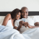 Husband and wife texting in bed ~ MarriageHeat