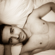Sexy Husband with warm brown eyes looking up from the bed ~ MarriageHeat