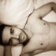 Sexy Husband with warm brown eyes looking up from the bed ~ MarriageHeat