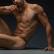 As descibed, erotic photo of nude male, shapely ass slightly pancaked.