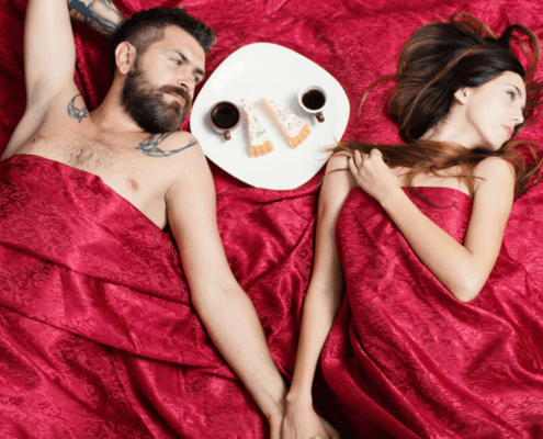 A husband and wife share cake and hold hands under silky red sheets~ MarriageHeat