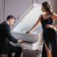 Husband plays the piano while his sexy wife looks on ~ MarriageHeat