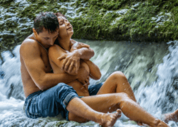 Loving married couple embrace under a waterfall ~ MarriageHeat