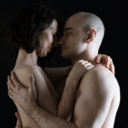 Husband and wife kissing in the dark ~ MarriageHeat